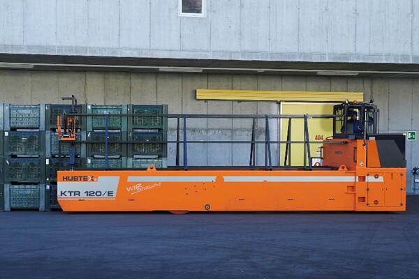 HUBTEX apple crate transporter lifting a load